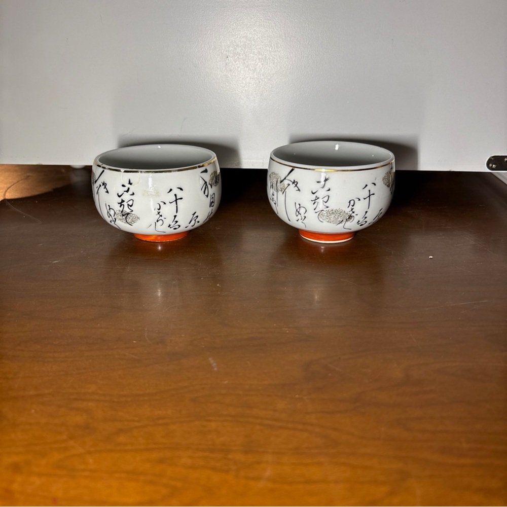 White and Orange Ceramic Tea Cups